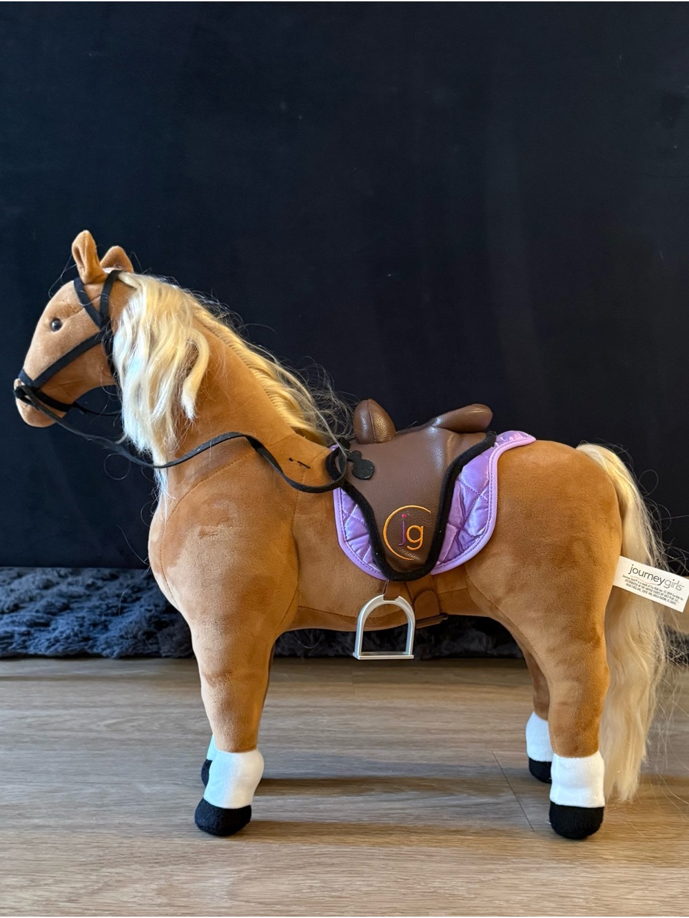 Plush Ride-On Horse in Brown with Purple Saddle Pad